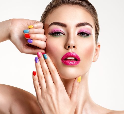 beautiful-fashion-woman-with-a-colored-nails-attra-JKURVSM.jpg